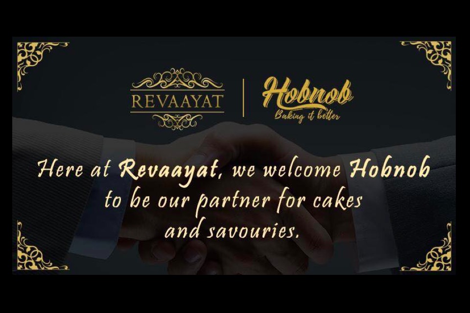 Revaayat shake hands with Hobnob bakers Revaayat